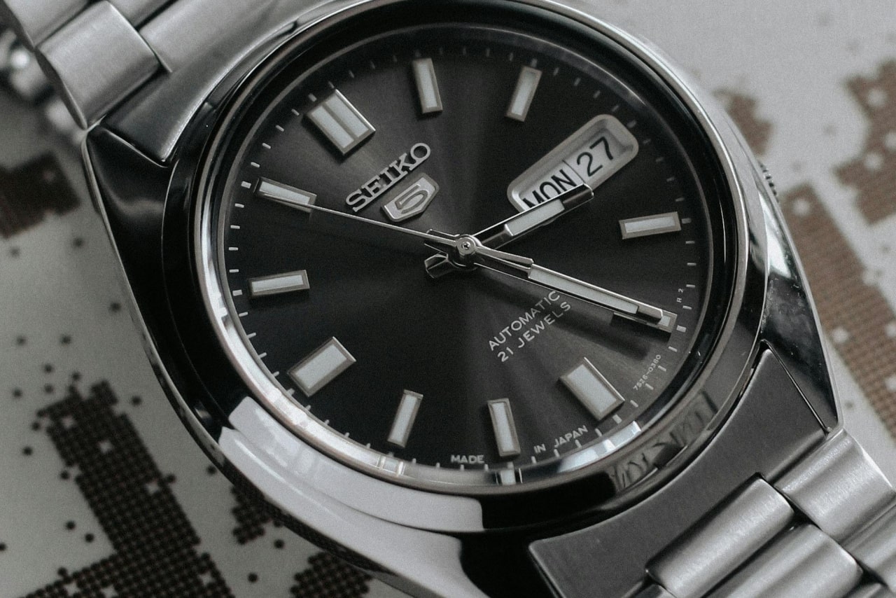 A close-up of a handsome and sleek stainless steel Seiko watch.