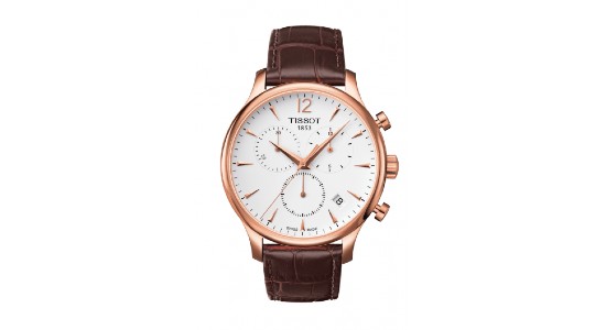 A rose gold Tissot watch with a leather strap, available at Huntington Fine Jewelers.