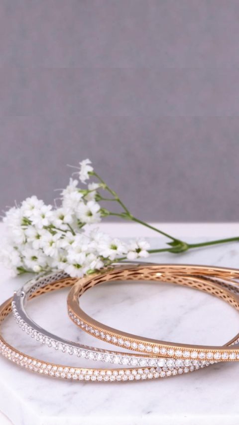 Silver and gold necklaces with diamond center stones