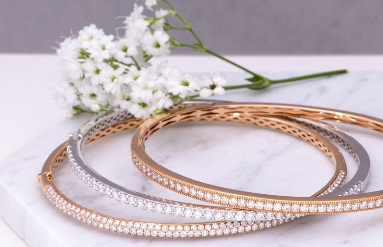 Silver and gold necklaces with diamond center stones