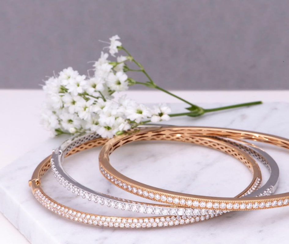 Silver and gold necklaces with diamond center stones