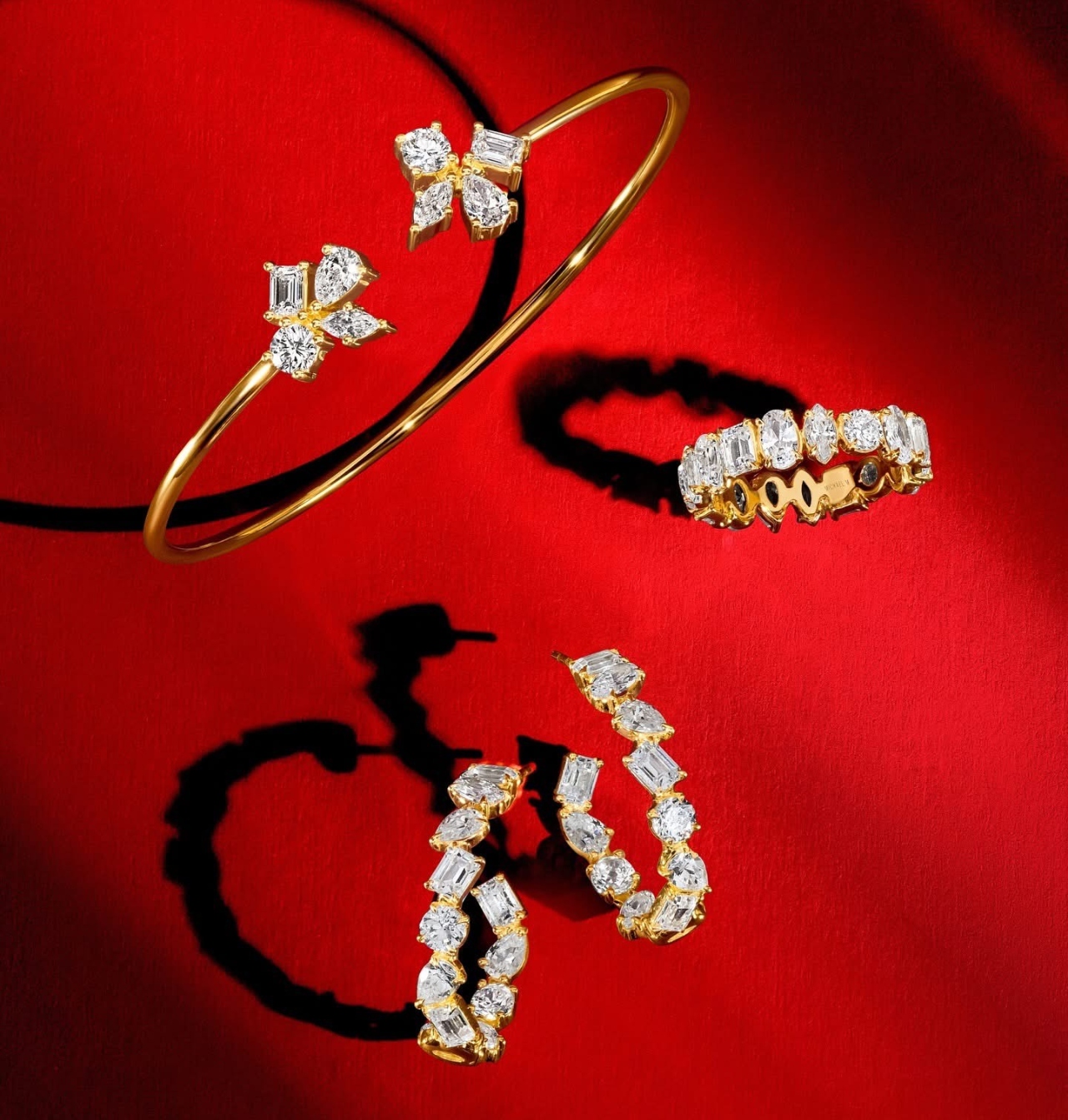 Diamond and yellow gold cuff, hoops, and ring by Michael M that utilizes different shapes of diamonds Diamond and yellow gold cuff, hoops, and ring by Michael M that utilizes different shapes of diamonds