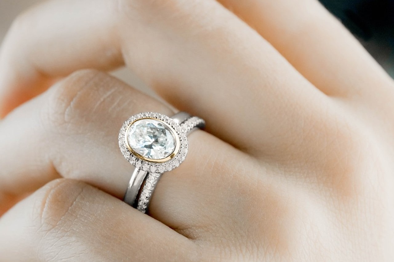a Noam Carver diamond engagement ring worn with a wedding band a Noam Carver diamond engagement ring worn with a wedding band