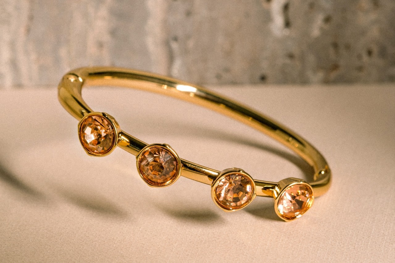 a yellow gold fashion ring featuring four round cut citrine gems a yellow gold fashion ring featuring four round cut citrine gems
