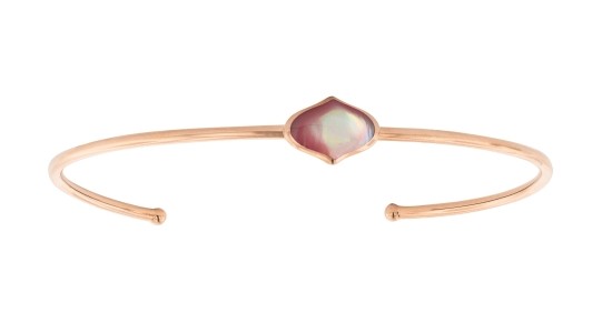 A rose gold Kabana cuff bracelet with an opalescent center stone, available at Huntington Fine Jewelers.
