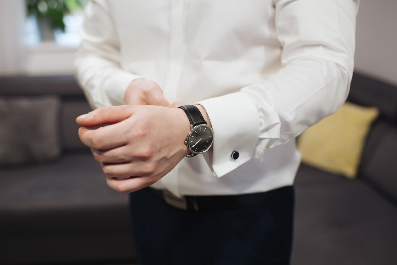 man in white button up with white watch man in white button up with white watch